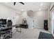 Open bonus room with a home office area and sliding glass doors at 1014 Falling Rock Pl, Durham, NC 27703