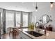 Bright kitchen island with a sink and modern light fixture at 1014 Falling Rock Pl, Durham, NC 27703