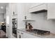Gourmet kitchen with stainless steel appliances and gas cooktop at 1014 Falling Rock Pl, Durham, NC 27703