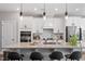 Bright kitchen featuring an island with bar seating and modern pendant lighting at 1014 Falling Rock Pl, Durham, NC 27703