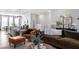 Comfortable living room featuring hardwood floors, stylish furniture, and an open layout to the kitchen at 1014 Falling Rock Pl, Durham, NC 27703
