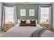 Serene main bedroom featuring natural light, neutral tones, and stylish furnishings at 1014 Falling Rock Pl, Durham, NC 27703