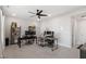 Spacious home office featuring carpet flooring, ceiling fan and two desks at 1014 Falling Rock Pl, Durham, NC 27703