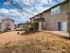 Cozy townhouse backyard featuring a sliding glass door and a small patio area at 102 Forrymast Trl, Apex, NC 27539