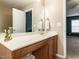 Bathroom vanity with a mirror and a door leading to the adjacent room enhancing the space's functionality at 102 Forrymast Trl, Apex, NC 27539