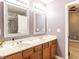 Bathroom with double vanity and views to the main bedroom at 102 Forrymast Trl, Apex, NC 27539