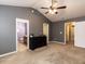 Bedroom features ceiling fan and easy access to private bathroom and walk-in closet at 102 Forrymast Trl, Apex, NC 27539