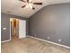 Bedroom features ceiling fan and easy access to walk-in closet at 102 Forrymast Trl, Apex, NC 27539
