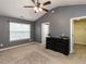 Bedroom featuring gray walls, neutral carpet, and a ceiling fan at 102 Forrymast Trl, Apex, NC 27539