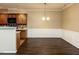 Dining area features hardwood floors, neutral paint, and wainscoting at 102 Forrymast Trl, Apex, NC 27539