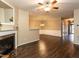 Open-concept living room with hardwood floors and marble fireplace at 102 Forrymast Trl, Apex, NC 27539