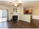 Cozy living room with fireplace and sliding door; open to adjacent kitchen area at 102 Forrymast Trl, Apex, NC 27539