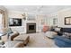 Cozy living room featuring a fireplace, elegant mantel, and neutral decor, creating a warm atmosphere at 102 Seabreeze Ct, Cary, NC 27513