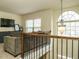 Open living space with large windows, natural light, and a view from the staircase at 104 Black Swan, Youngsville, NC 27596