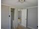 Bedroom featuring light gray walls and door opening to a small closet at 106 W Allen St, Four Oaks, NC 27524