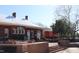 Exterior view of The Depot brick building with a red train car and patio at 1110 Lexington Farm Rd, Apex, NC 27502