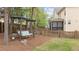 Charming backyard swing and seating area under a pergola, perfect for relaxation at 1117 Golden Star Way, Wake Forest, NC 27587