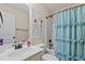 Well-lit bathroom features a vanity, mirror, and bathtub with blue floral shower curtain for a refreshing and stylish feel at 1117 Golden Star Way, Wake Forest, NC 27587