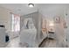 Charming bedroom with a four-poster bed, soft lighting, and delightful decor creates a warm and inviting space at 1117 Golden Star Way, Wake Forest, NC 27587