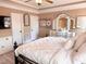 Bright bedroom featuring a large bed, dresser with mirror, and natural light at 1117 Golden Star Way, Wake Forest, NC 27587