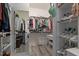 Walk-in closet with custom shelving and ample storage space for shoes and clothing at 1117 Golden Star Way, Wake Forest, NC 27587