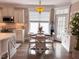 Cozy dining area with a round table and chairs near a bright window at 1117 Golden Star Way, Wake Forest, NC 27587