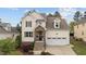 Attractive two-story home with stone accents, well-manicured landscaping, and an attached garage at 1117 Golden Star Way, Wake Forest, NC 27587
