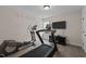 Well-equipped home gym with modern exercise machines, providing a convenient space for fitness and healthy living at 1117 Golden Star Way, Wake Forest, NC 27587