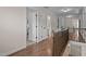 Bright hallway features hardwood floors, white doors, and access to multiple rooms in this well-maintained home at 1117 Golden Star Way, Wake Forest, NC 27587