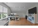 Spacious home office featuring hardwood floors, large desk, and natural light, creating a productive and inviting workspace at 1117 Golden Star Way, Wake Forest, NC 27587