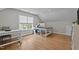 Bright home office featuring hardwood floors, large desk, and natural light, providing a comfortable and efficient workspace at 1117 Golden Star Way, Wake Forest, NC 27587