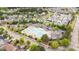 Aerial view of the neighborhood pool area with winding pool, clubhouse, and parking at 1117 Golden Star Way, Wake Forest, NC 27587