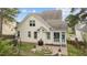 Cream-colored home with a screened porch, well-kept lawn, and a backyard trampoline at 1117 Golden Star Way, Wake Forest, NC 27587