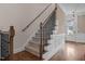 Staircase with carpet and wood flooring and views of the front door at 1117 Golden Star Way, Wake Forest, NC 27587