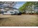 Expansive backyard with a large deck perfect for entertaining, surrounded by mature trees for privacy at 1122 Virginia Water Dr, Rolesville, NC 27571