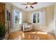 Cozy living room with hardwood floors, a ceiling fan, and windows that let in natural light at 1419 Norton St, Durham, NC 27701