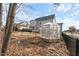 Backyard featuring a greenhouse and the exterior of the home at 1421 Sweetclover Dr, Wake Forest, NC 27587