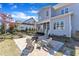 Backyard patio with a fire pit, sitting area, and view of the home's exterior at 1421 Sweetclover Dr, Wake Forest, NC 27587