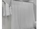 Clean bathroom with fresh white towels and a shower curtain, offering a minimalist and functional design at 1421 Sweetclover Dr, Wake Forest, NC 27587