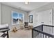 A Bedroom with carpet, a rocking chair, and a crib at 1421 Sweetclover Dr, Wake Forest, NC 27587
