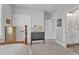 Serene bedroom with neutral tones, features an ensuite bathroom and ample closet space for convenience at 1421 Sweetclover Dr, Wake Forest, NC 27587