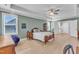 Large bedroom features hardwood floors, windows, and neutral wall colors at 1421 Sweetclover Dr, Wake Forest, NC 27587