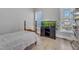 Neutral-colored bedroom with an aquarium, a wooden bedframe and natural light at 1421 Sweetclover Dr, Wake Forest, NC 27587