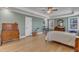 Spacious bedroom features hardwood floors, windows, and neutral wall colors at 1421 Sweetclover Dr, Wake Forest, NC 27587