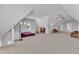 Spacious bonus room featuring neutral carpet, ample natural light, and versatile layout for living or entertaining at 1421 Sweetclover Dr, Wake Forest, NC 27587