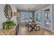 Bright dining area with modern furniture and a view of the outdoors at 1421 Sweetclover Dr, Wake Forest, NC 27587
