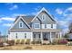 Charming two-story home with a covered front porch and professionally landscaped yard at 1421 Sweetclover Dr, Wake Forest, NC 27587