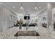 The sink from kitchen island overlooks living room and fireplace at 1421 Sweetclover Dr, Wake Forest, NC 27587