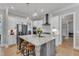Open kitchen with a large center island, stainless steel appliances, and white cabinetry at 1421 Sweetclover Dr, Wake Forest, NC 27587