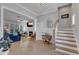 Open-concept living room with hardwood floors, fireplace, and elegant decor at 1421 Sweetclover Dr, Wake Forest, NC 27587